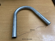 USEFUL BIT OF BENT TUBE (PART OF A WHEELBARROW)